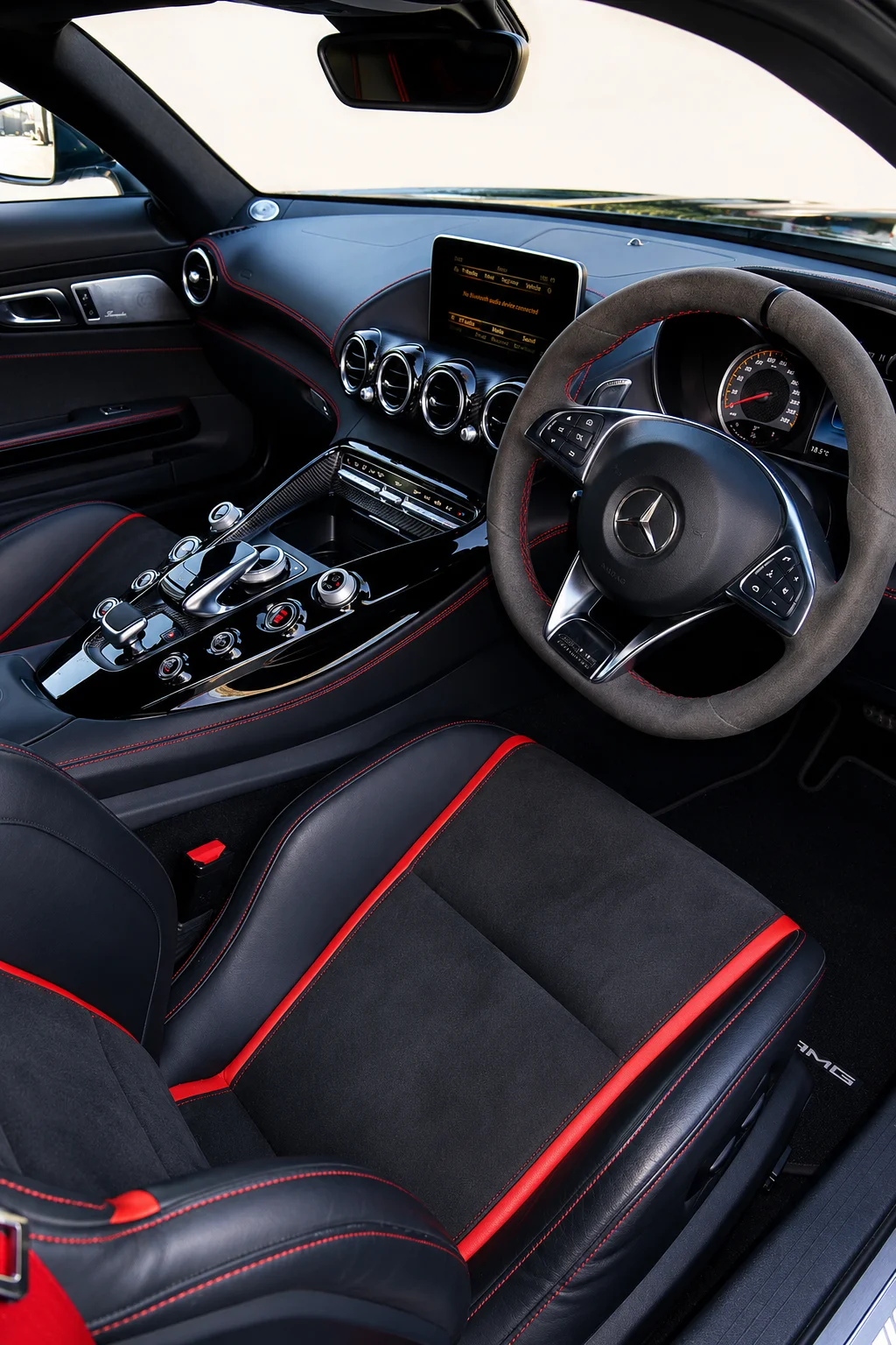 Interior of a Mercedes-AMG GT showing the black and red cabin