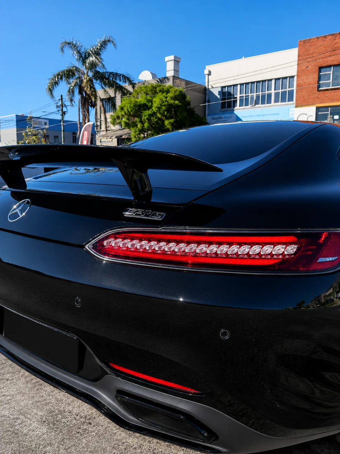 Black Mercedes-AMG GT rear view parked on a Sydney street