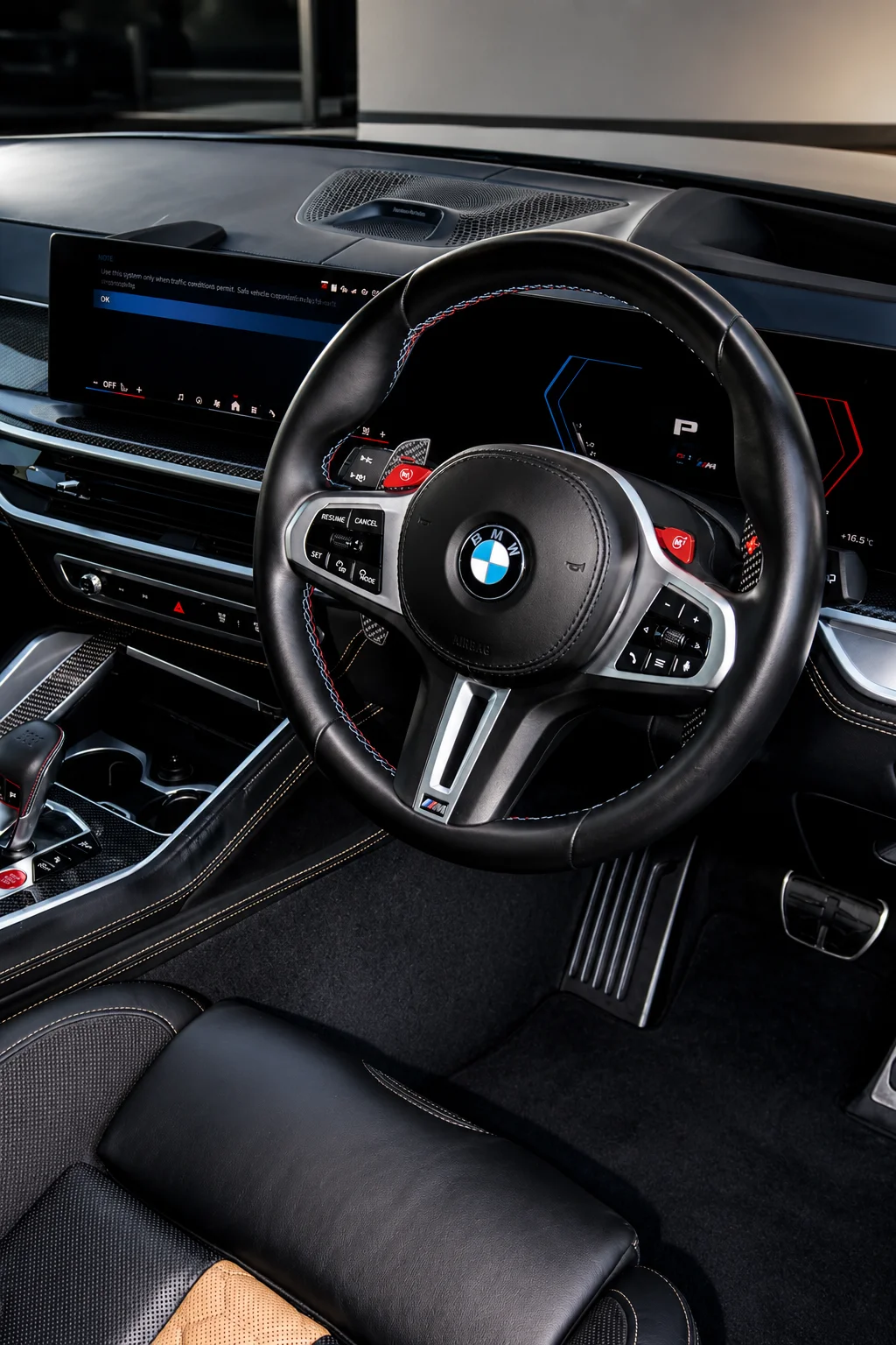 BMW interior showing the steering wheel and digital instrument cluster
