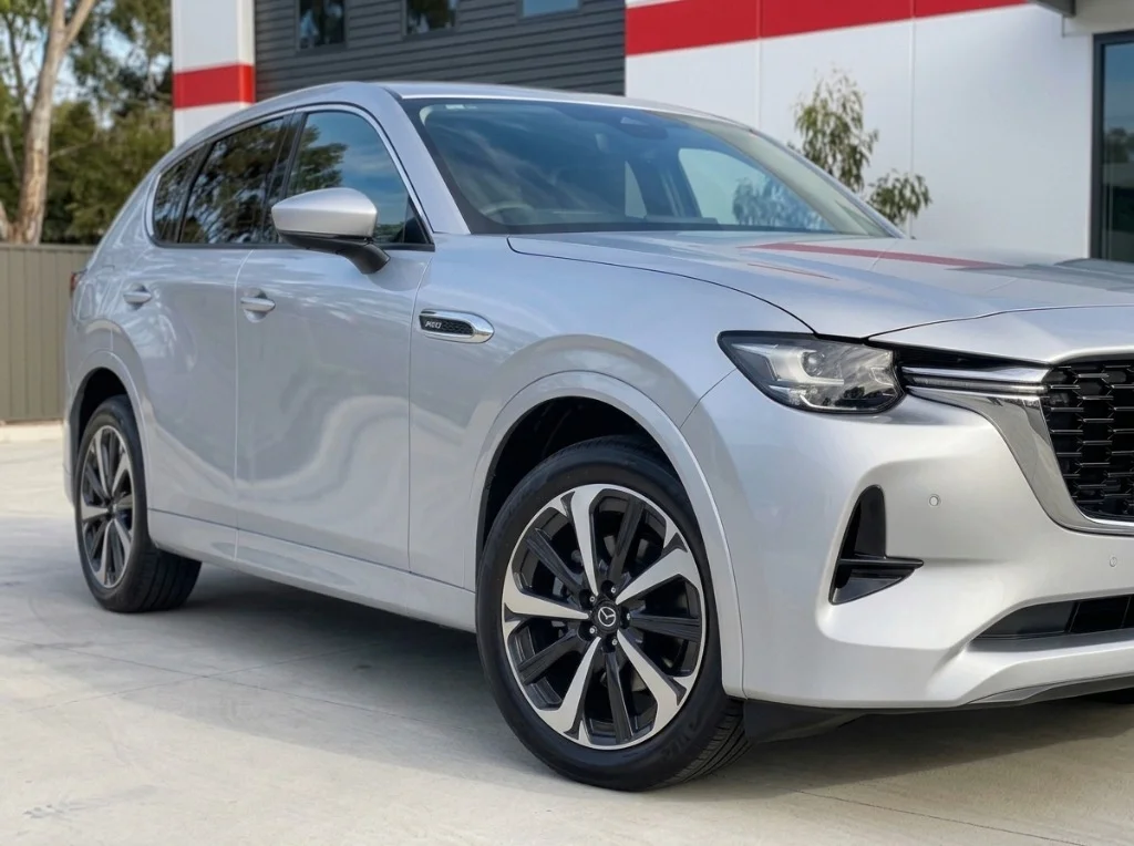 Repaired silver Mazda CX-80 outside the Stow Smash Repairs workshop